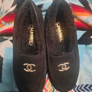 CHANEL Black Shearling-Lined Suede Calfskin CC Loafers.